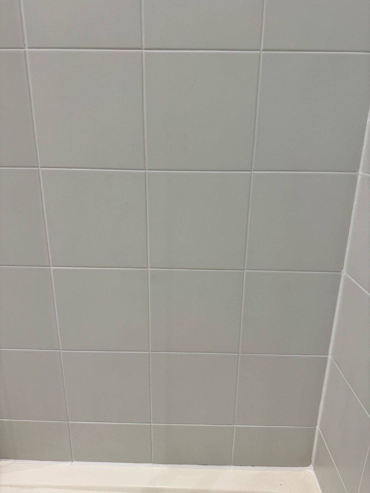 Recoloured floor tiles and grout lines